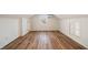 Second floor bonus room featuring dormer windows, mini-split system, and hardwood floors at 1140 Goodwin Ne Pl, Atlanta, GA 30319