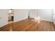 Spacious bedroom with hardwood floors, white walls, and a connecting bathroom at 1140 Goodwin Ne Pl, Atlanta, GA 30319