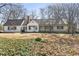 Charming single-story home featuring a covered front porch and mature trees on a spacious lot at 1140 Goodwin Ne Pl, Atlanta, GA 30319