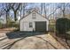 Detached garage with asphalt driveway and fenced yard at 1140 Goodwin Ne Pl, Atlanta, GA 30319