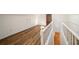 Upstairs hallway featuring white wainscoting and light hardwood flooring at 1140 Goodwin Ne Pl, Atlanta, GA 30319