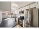 Well-equipped kitchen with stainless steel appliances, white cabinets, and stone countertops at 1140 Goodwin Ne Pl, Atlanta, GA 30319