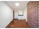 Functional laundry room featuring brick accents, a white washer and dryer, and exterior access at 1140 Goodwin Ne Pl, Atlanta, GA 30319