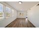 Bright living room with wood floors and multiple windows providing plenty of natural light at 1140 Goodwin Ne Pl, Atlanta, GA 30319