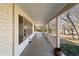 Inviting covered porch with wooden flooring and railing, offering a relaxing outdoor space at 1140 Goodwin Ne Pl, Atlanta, GA 30319