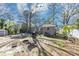 View of backyard with patio, table and chairs, privacy fence and shed at 2754 Drew Valley Ne Rd, Atlanta, GA 30319