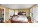 Bedroom with wood floors, large windows and closet, and king size bed at 2754 Drew Valley Ne Rd, Atlanta, GA 30319