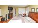 Bedroom with wood floors, closet, TV and king size bed at 2754 Drew Valley Ne Rd, Atlanta, GA 30319