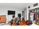 Bedroom features hardwood floors, white walls, a desk and a closet; it's also littered with items at 2754 Drew Valley Ne Rd, Atlanta, GA 30319