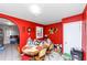 Bright dining room featuring red walls, tile floors, and a table with chairs at 2754 Drew Valley Ne Rd, Atlanta, GA 30319