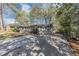 Long, paved driveway leading to a single-story brick home with mature trees and landscaping at 2754 Drew Valley Ne Rd, Atlanta, GA 30319