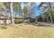 Well-maintained single-story home with a front lawn, shrubbery, and a paved driveway at 2754 Drew Valley Ne Rd, Atlanta, GA 30319