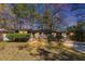 Charming single-story home featuring a brick facade, well-maintained lawn, and mature trees at 2754 Drew Valley Ne Rd, Atlanta, GA 30319