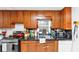 A close up of the kitchen featuring a sink, window, wooden cabinets and a black countertop at 2754 Drew Valley Ne Rd, Atlanta, GA 30319