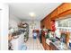 Galley kitchen featuring wooden cabinets, a black countertop, white tile floors and a stainless steel refrigerator at 2754 Drew Valley Ne Rd, Atlanta, GA 30319