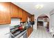 A kitchen features black counter tops, wooden cabinets and a stove with stainless steel finish at 2754 Drew Valley Ne Rd, Atlanta, GA 30319