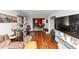 Spacious living room with hardwood floors, a television, and an archway to the dining area at 2754 Drew Valley Ne Rd, Atlanta, GA 30319