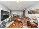 Cozy living room featuring hardwood floors and a plush brown sectional sofa at 2754 Drew Valley Ne Rd, Atlanta, GA 30319