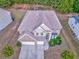 An aerial view of a suburban house with a large roof and a two car garage at 3510 Long Lake Dr, Douglasville, GA 30135