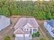 A spacious suburban home surrounded by lush trees, showcasing its well-manicured lawn at 3510 Long Lake Dr, Douglasville, GA 30135