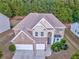 Aerial view of a large suburban home featuring manicured landscaping and an attached two-car garage at 3510 Long Lake Dr, Douglasville, GA 30135