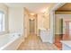 Bright bathroom featuring a soaking tub and vanity at 3510 Long Lake Dr, Douglasville, GA 30135