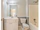 Bathroom with vanity, mirror, and shower-tub combo at 3510 Long Lake Dr, Douglasville, GA 30135