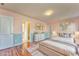 Well-lit bedroom with hardwood floors and elegant decor at 3510 Long Lake Dr, Douglasville, GA 30135
