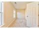 Bright bedroom featuring neutral carpet, paint, and trim, bathed in natural light from a double window at 3510 Long Lake Dr, Douglasville, GA 30135