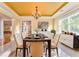 Elegant dining room with a modern chandelier, and large windows at 3510 Long Lake Dr, Douglasville, GA 30135