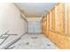 An unfinished garage showing the bare walls, cement floor, and garage door at 3510 Long Lake Dr, Douglasville, GA 30135