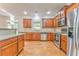 Well-lit kitchen featuring wood cabinets, stainless steel appliances, and hardwood floors at 3510 Long Lake Dr, Douglasville, GA 30135