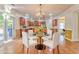 Inviting kitchen and breakfast nook featuring hardwood floors and wood cabinets at 3510 Long Lake Dr, Douglasville, GA 30135