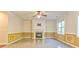 Bright living room featuring a fireplace and decorative wall paneling at 3510 Long Lake Dr, Douglasville, GA 30135