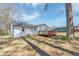 Backyard view of the home with a wooden deck and spacious yard at 381 Warner Se, Marietta, GA 30060