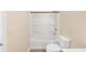 Bright bathroom featuring a shower-tub combination with a toilet at 381 Warner Se, Marietta, GA 30060