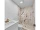 Updated bathroom with a decorative pebble floor shower and sleek fixtures at 381 Warner Se, Marietta, GA 30060