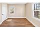 Sun-filled bedroom featuring hardwood floors and multiple windows at 381 Warner Se, Marietta, GA 30060