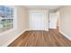 Bedroom with updated hardwood floors, large closet, and natural light at 381 Warner Se, Marietta, GA 30060
