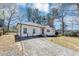 Inviting single-story home with a clean exterior, long driveway, and a welcoming front yard space at 381 Warner Se, Marietta, GA 30060