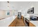 Well-lit kitchen showcases updated appliances, custom cabinets, and a spacious layout at 381 Warner Se, Marietta, GA 30060