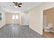 Large living room showcases updated flooring, natural light, and access to the bathroom at 381 Warner Se, Marietta, GA 30060