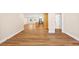 Expansive open-concept area showcasing hardwood floors, a modern kitchen island, and ample living space at 381 Warner Se, Marietta, GA 30060