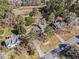 Overhead view displays the property's location with surrounding mature trees and proximity to other homes and roads at 610 Amberwood Pl, Euharlee, GA 30145