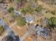 Aerial view showcasing the property and surrounding neighborhood with mature trees and well-maintained lawns at 610 Amberwood Pl, Euharlee, GA 30145