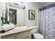 Bathroom featuring a vanity with a sink and a toilet with a patterned shower curtain at 610 Amberwood Pl, Euharlee, GA 30145