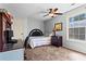 Bedroom with a bed, a desk, and an overhead ceiling fan at 610 Amberwood Pl, Euharlee, GA 30145