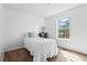 Bright bedroom features natural light from window and charming decor accents at 610 Amberwood Pl, Euharlee, GA 30145