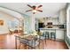 Bright dining room with a glass table and zebra print chairs at 610 Amberwood Pl, Euharlee, GA 30145