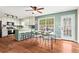 Open dining area featuring a view to the kitchen, stylish furniture, and natural light, creating a welcoming space at 610 Amberwood Pl, Euharlee, GA 30145